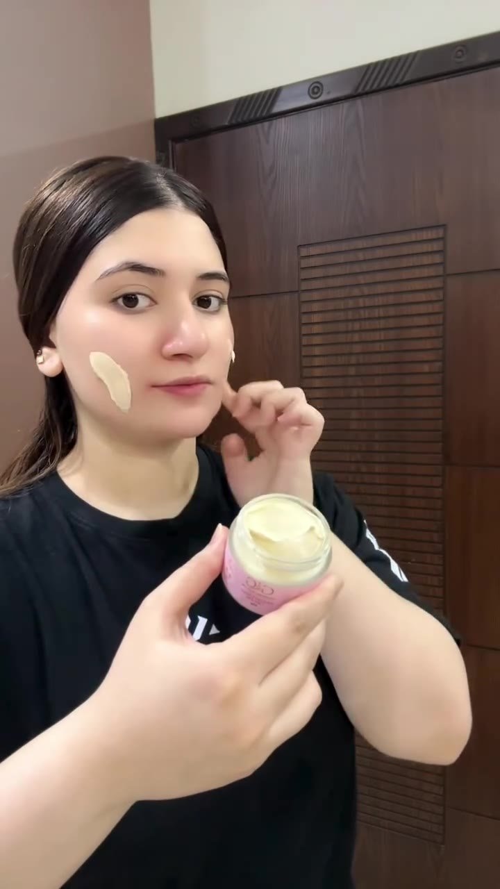 G&G Brightening Cream creator holding the cream jar